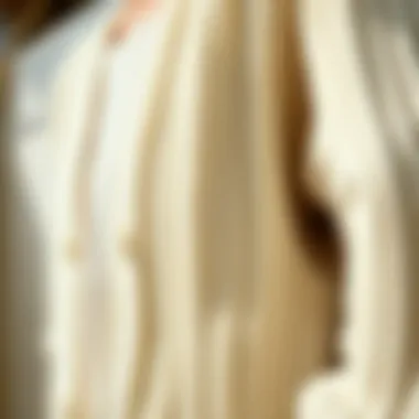 Close-up of Soft Textured Fabric Close-up of soft, textured fabric of a white knit cardigan.