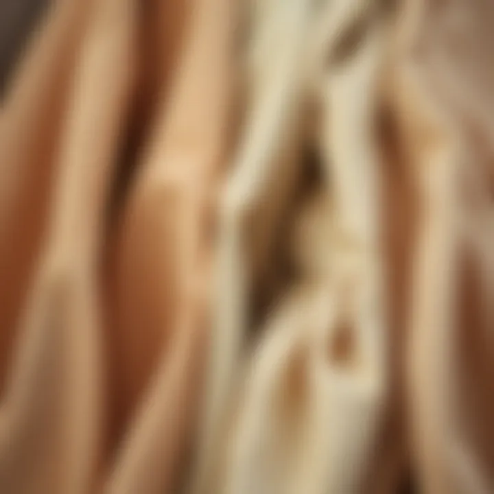 Close-up of different fabric textures of beige blouses