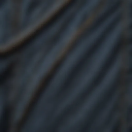 A close-up of denim fabric with intricate stitching