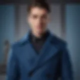 A stylish blue winter coat displayed on a mannequin, showcasing its elegant design.