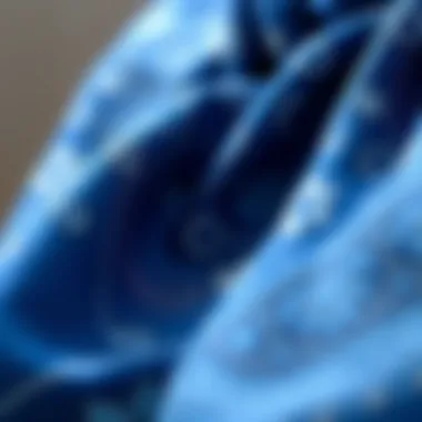 Intricate Patterns on Blue Silk Scarf Close-up of intricate patterns on blue silk scarf