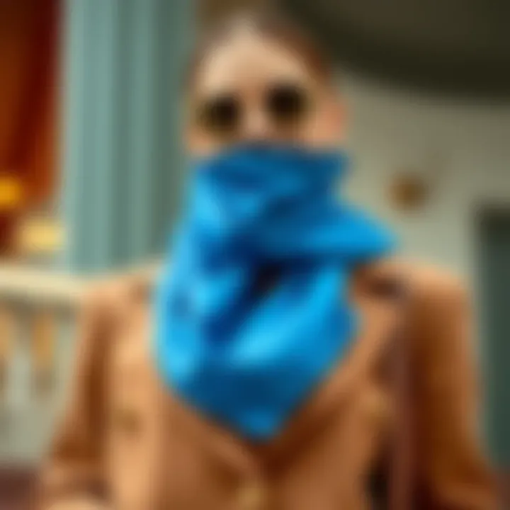 Stylish blue silk scarf draped over a fashion outfit