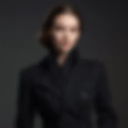 Elegant black cashmere coat draped over a sophisticated outfit