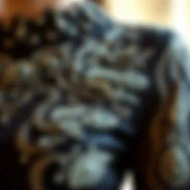 Close-up of intricate detailing on a black stone dress, highlighting craftsmanship